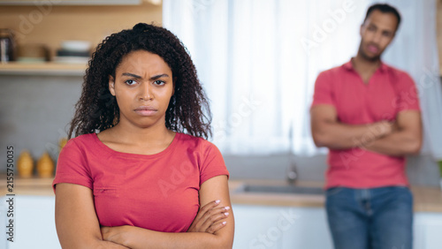 Photography Frustrated Black Female With Angry Expression And Arms Crossed Standing In Kitchen, Facing Away From Male Partner, Having Argument