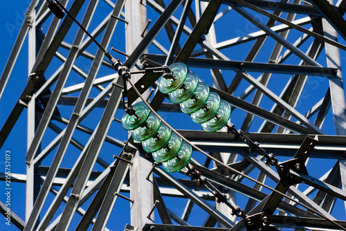Fotografie Close-up of glass insulators on a steel transmission tower high-voltage power li