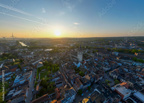 Halle, Vlaams Brabant, Belgium, 27th of April, 2025, A breathtaking aerial photograph beautifully captures a stunning cityscape during sunset, showcasing vibrant colors