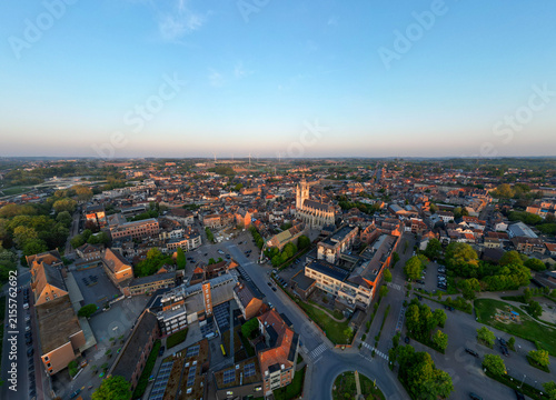 Halle, Vlaams Brabant, Belgium, 27th of April, 2025, A stunning aerial perspective that beautifully showcases a bustling cityscape during the enchanting twilight hours
