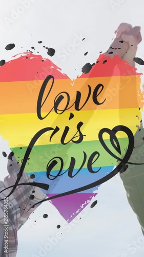Animation of rainbow heart and love is love over lesbian couple holding hands outdoors