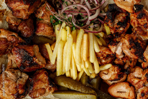 Принти на полотні Grilled meat platter with pork and chicken shish kebab and french fries