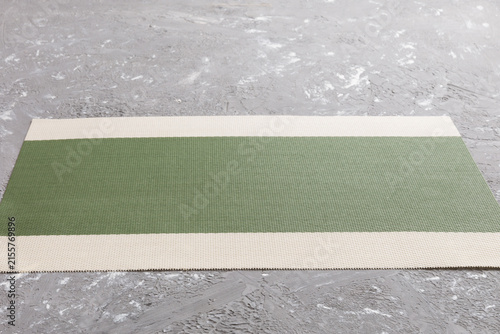 Perspective view of green tablecloth for food on cement background. Empty space for your design