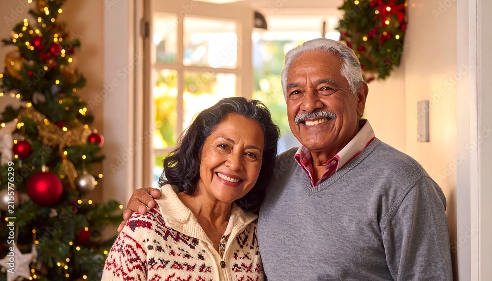 Fototapeta premium Happy senior couple celebrating Christmas together indoors.