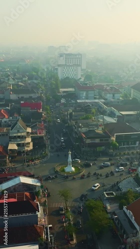 Aerial panorama of Tugu Yogyakarta landmark amid hazy cityscape