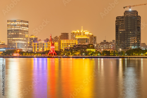 Modern urban architecture, road traffic, and Huangpu River night view in Lujiazui, Pudong, Shanghai, China	