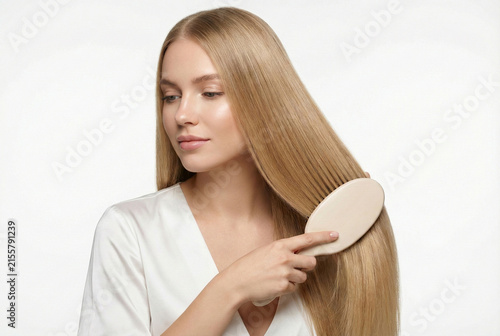 Relaxed Woman Experimenting With Her Lengthy Blonde Locks During Casual Beauty Tutorial
