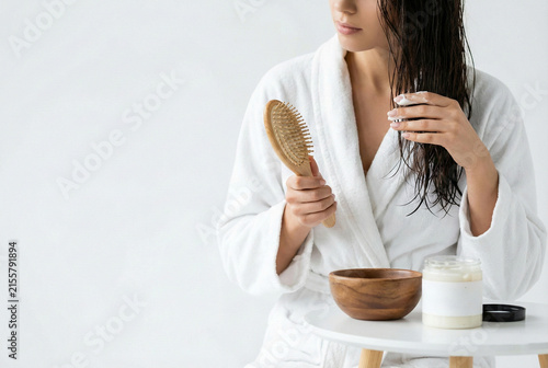 Quiet Setting Featuring Woman Using Organic Products To Care For Herself At Sunrise