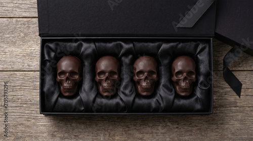 Luxurious dark chocolate skulls in black gift box