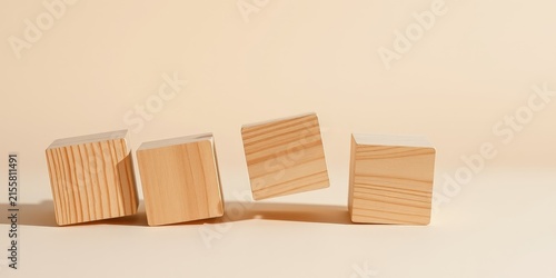 A simple arrangement of four wooden blocks on a minimalist background, showcasing the natural grain of the wood.
