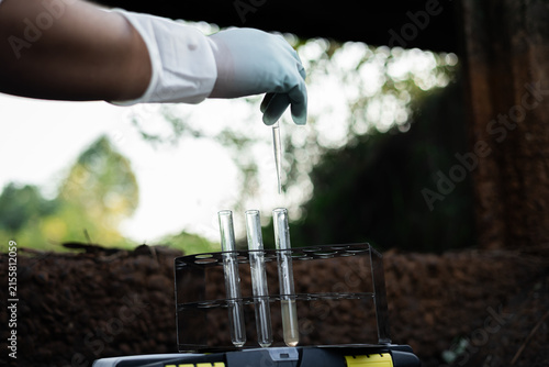Obraz na płótnie Environmental engineer collecting water quality assessment for detecting toxic chemical contamination in an irrigation canal