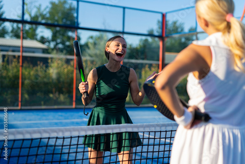 Photography Women cheering after playing padel tennis game