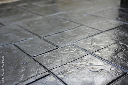 The concrete floor features beautiful patterns and intricate textures, distinguished by elegant geometric details and exquisite craftsmanship, creating a unique and visually appealing surface.