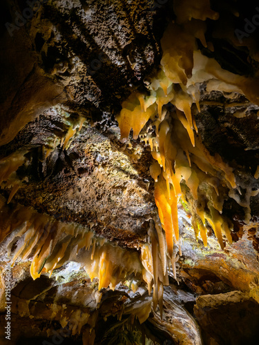 Bild auf Leinwand Rusty stalagmites inside the cave