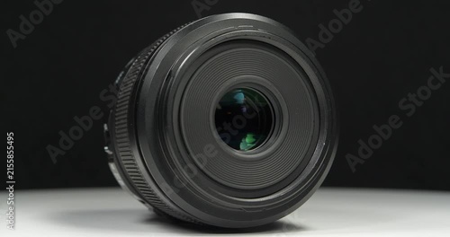 Black macro camera lens, video on black background