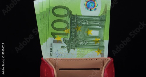 Cash. European money. New green five hundred Euros in five 100 euro banknotes. One hundred Euro banknotes in wallet