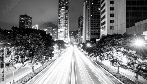 Street scene at night in a city showcasing captivating light trails from vehicles, concept of time
