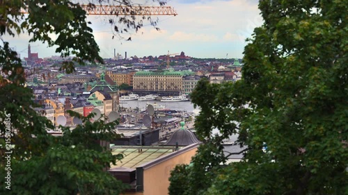 Stockholm city skyline framed by green trees, Sweden