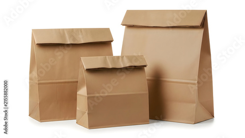Three brown paper bags for food delivery and shopping isolated on white background