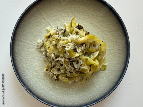 Delicious Mediterranean Style Rice with Zucchini Ribbons and Fresh Dill Served on a Modern Ceramic Plate