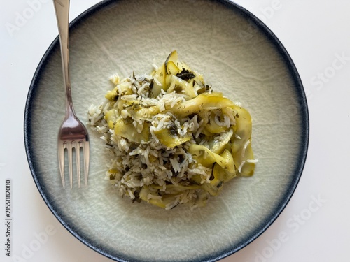 Delicious Mediterranean Style Rice with Zucchini Ribbons and Fresh Dill Served on a Modern Ceramic Plate