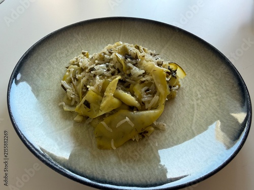 Delicious Mediterranean Style Rice with Zucchini Ribbons and Fresh Dill Served on a Modern Ceramic Plate