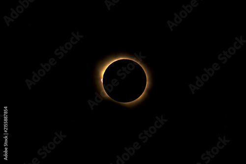 Canvas Print Total solar eclipse showing the diamond ring effect with solar prominences and c