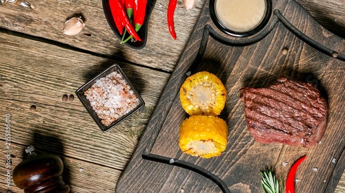 Fotografie Close up overhead view of rustic wooden surface scattered with cinnamon sticks r