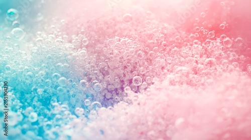 Pastel bubbles float in soft blue and pink hues