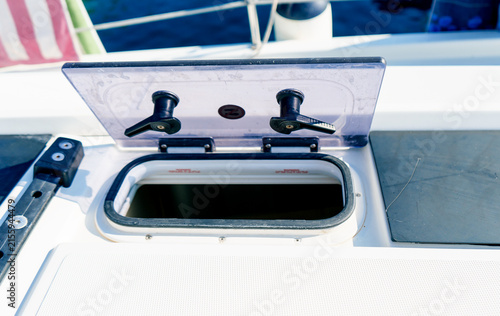 Konstfotografi Open deck hatch on a sailing yacht with marine equipment and sea view