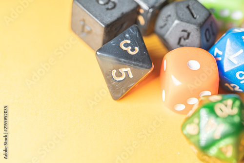 Konstfotografi Colorful tabletop roleplaying dice collection on yellow background The Concept o