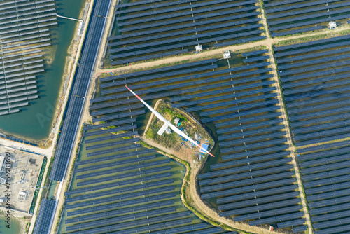  vast floating solar farm and wind turbines over water
