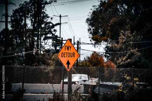 Картината върху платно Orange freeway detour sign with arrow indicating direction of alternate route