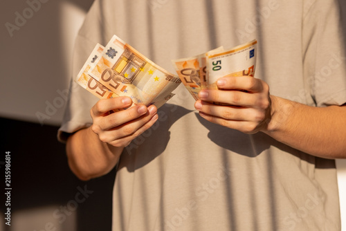 Comparing two stacks of fifty euro banknotes