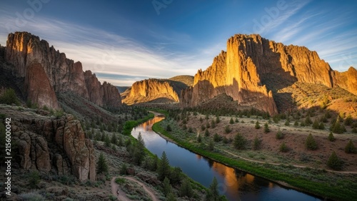 Scenic river winding through deep canyon at sunset light.