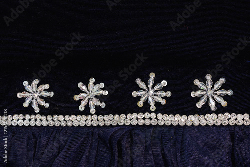Foto Close up of navy blue velvet fabric decorated with crystal bead star motifs and