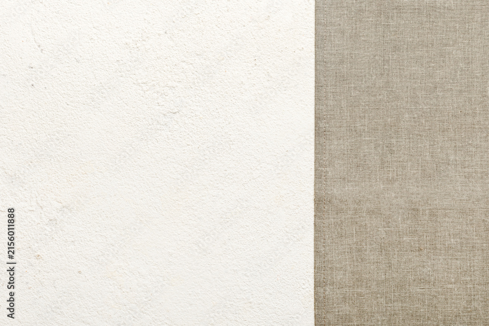 Fototapeta premium top view with gray kitchen napkin isolated on table background. Folded cloth for mockup with copy space, Flat lay. Minimal style