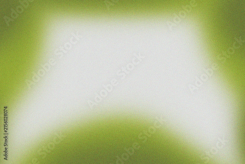 Abstract digital background featuring a subtle grainy texture with a bright white center and soft lime green edges, creating a gentle gradient effect.