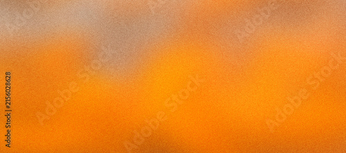 Warm orange gradient background with grainy noise texture. Vibrant wallpaper with blurred effect. Abstract sunset bokeh. Summer backdrop