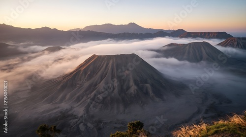 Breathtaking Aerial View of Mount Bromo Crater and Volcanic Cone Illuminated by Warm Sunrise Light