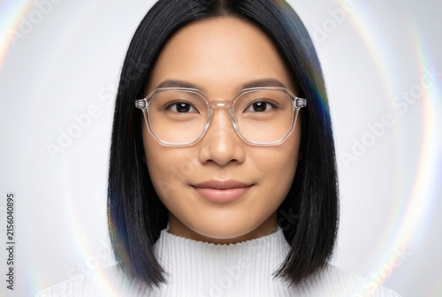 Woman With Clear Glasses and Sleek Black Hair in Prismatic Light