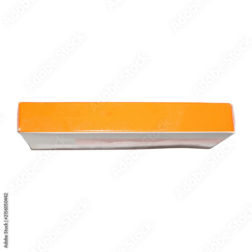 Orange and white rectangular box with glossy finish on plain surface