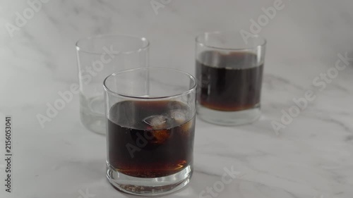 Tapping glass of soda with fingernail. Original sound. 24fps. Prores 422HQ
