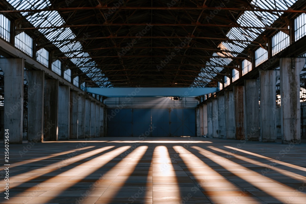Fototapeta premium Industrial warehouse interior with striped floor shadows from windows for background and poster design