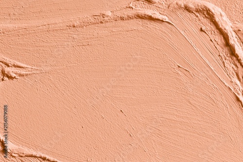 Warm peach terracotta plaster with visible brush strokes, raised ridges and uneven matte texture, creating a tactile imperfect background for branding, interiors and contemporary design.