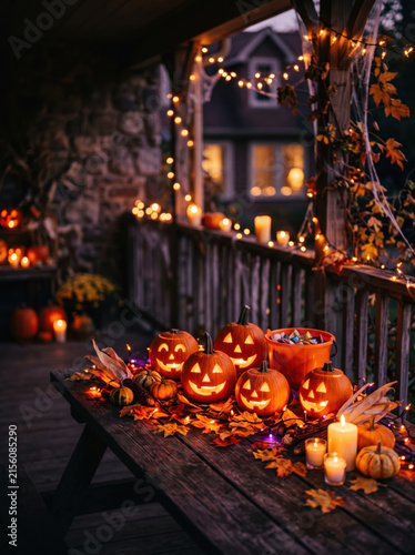 Halloween jack-o-lantern display on a candlelit porch