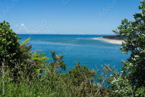 Coastal inlet and sandy shoreline at Waihī Beach