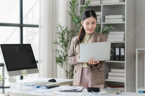 Картината върху платно Woman Working on Laptop in Office