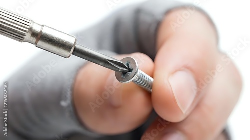 Obraz na płótnie Technician with light skin tone using precision drill bit tool