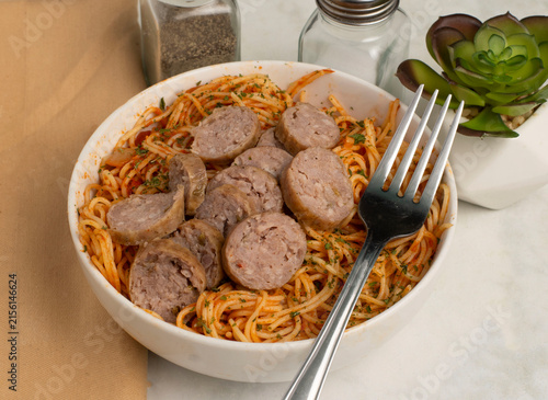 angel hair pasta  with sliced italian sausagge